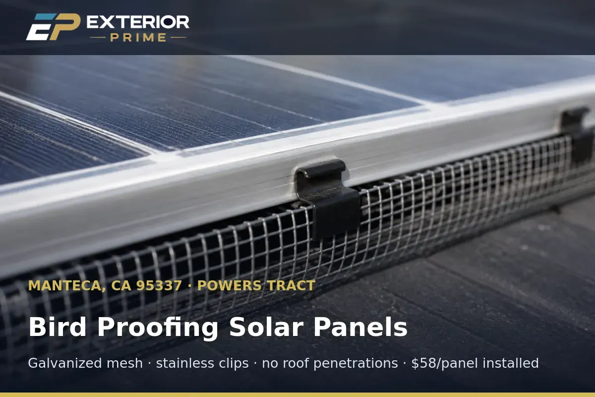 Close-up of galvanized bird proofing mesh clipped to the aluminum frame of a solar panel on a Manteca, CA roof