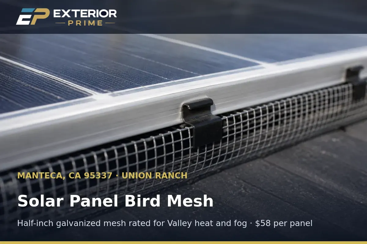 Half-inch galvanized bird mesh fitted along the lower edge of a solar panel on a Manteca, CA rooftop
