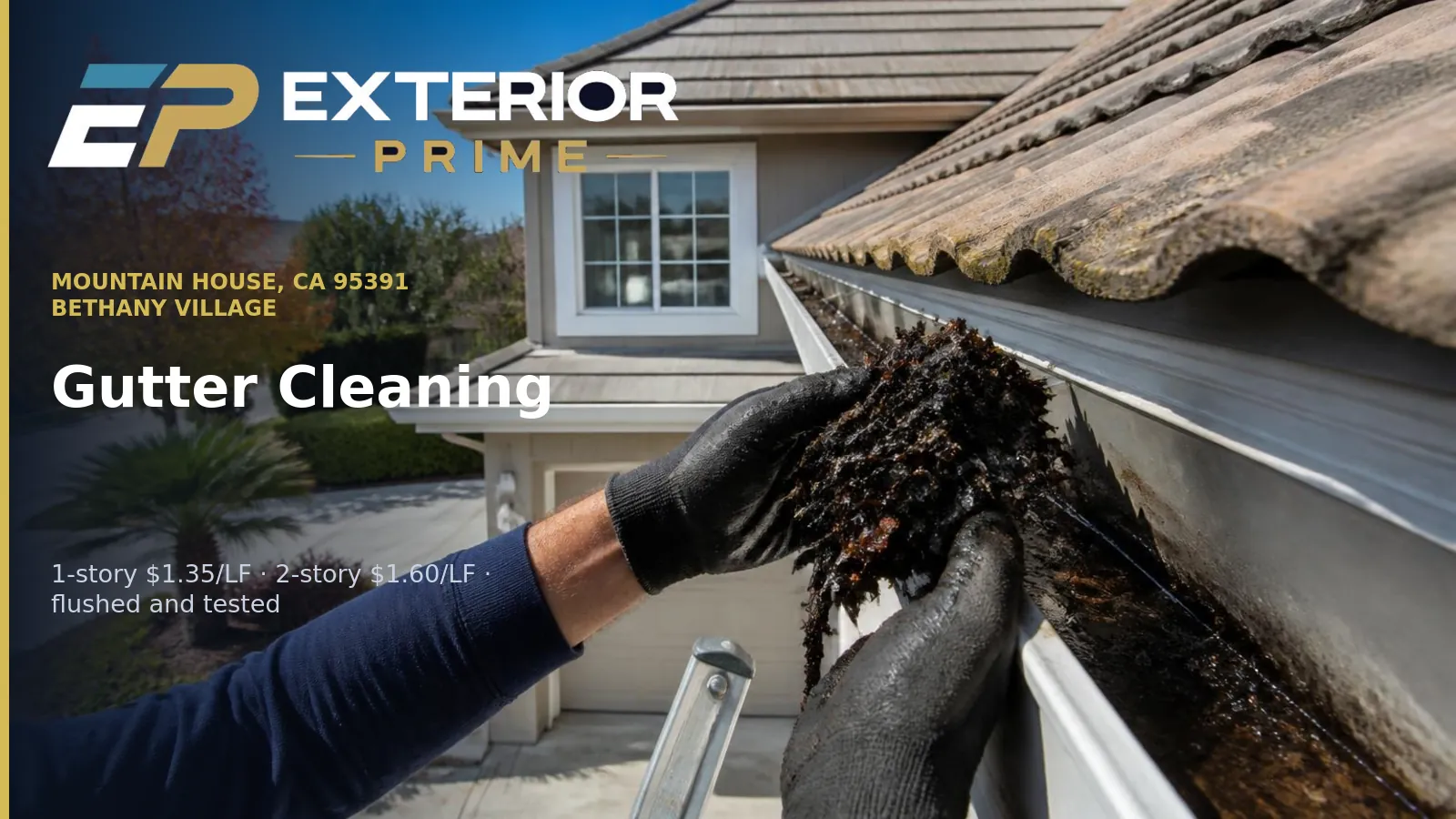 Gloved hands lifting packed wet leaf debris out of the aluminum gutter of a two-story Bethany village home in Mountain House, California, with concrete tile roof edge above
