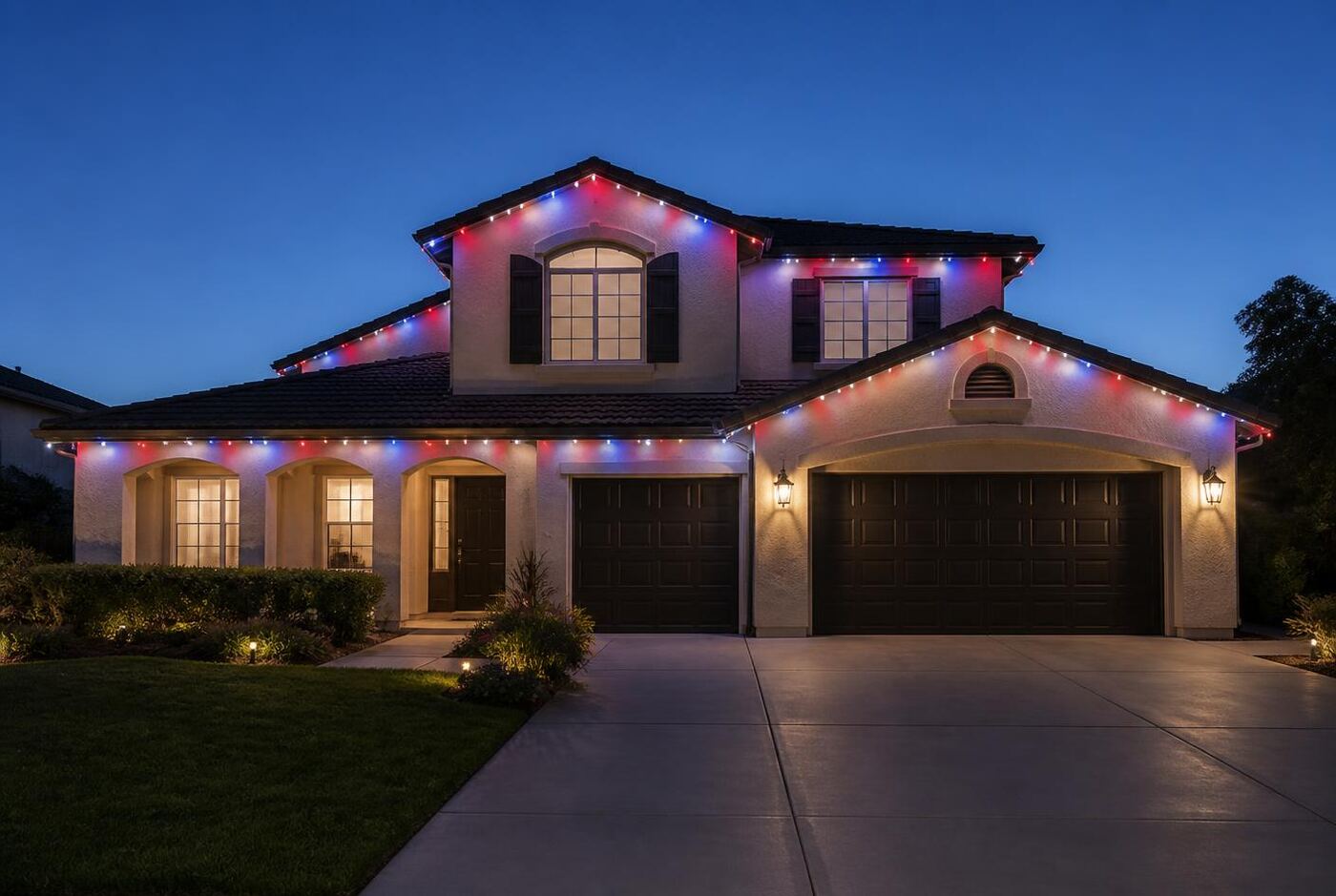 Permanent roofline lighting displaying red, white and blue colors for a Fourth of July display