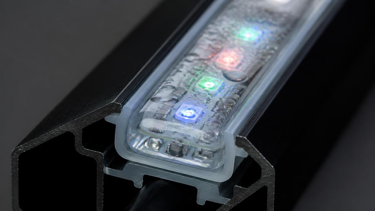 Macro photo of a sealed RGB LED module seated in aluminum track used on Tracy homes